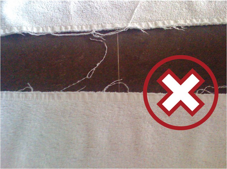Image shows non EcoKnit® Towels with frayed edges